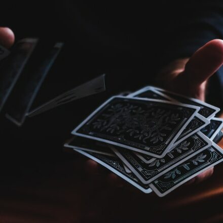 Hands Shuffling a Deck of Cards